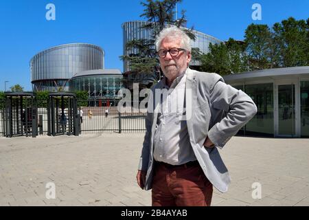France, Bas Rhin, Strasbourg, European district, the architect Claude Bucher in front of the building of the European Court of Human Rights that he designed with the architect Richard Rogers Stock Photo