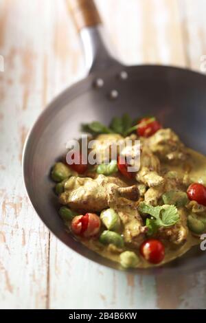 Wok, chicken wing curry Stock Photo