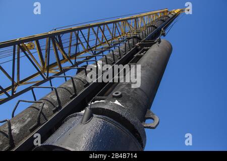 Diesel hammer machine for installing concrete piles for the foundation of a new building Stock Photo
