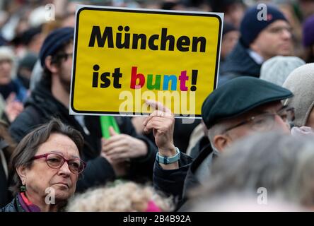 Munich, Germany. 06th Mar, 2020. Demonstrators take part in the rally against AfD and right-wing terror under the motto 'Just don't do it', holding a poster with the slogan 'Munich is colorful' in their hands. Credit: Sven Hoppe/dpa/Alamy Live News Stock Photo