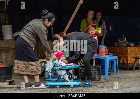 Laos, Phongsaly province, Muang Khua town, women and baby Stock Photo