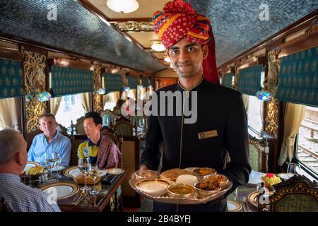 Indian food served inside one of the dining cars of the Luxury train Maharajas express train. Jodhpur Rajasthan India.