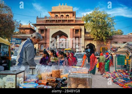 Clothing and food stores in Sardar Market square in Jodhpur city Rajasthan India. This is one of the excursion of the Luxury train Maharajas express. Stock Photo