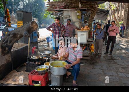 Food stall street snack in Mahatma Gandhi Road with Veer Nariman Road in Kala Ghoda area Mumbai city maharashtra India Asia. Stock Photo