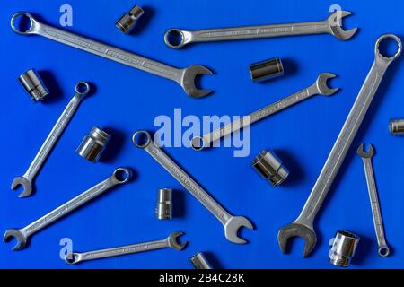 Moscow/Russia - March 2020: Set of wrenches and hex sockets on the bright blue background. Do it yourself (DIY) concept. Top view. Stock Photo