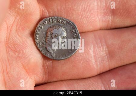 Roman silver coin with portrait of caesar Stock Photo