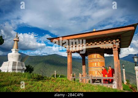 Nuns at Sangchhen Dorji Lhendrub Choling Nunnery a Buddhist Nuns College and temple stupa Punakha Bhutan. Sangchchen Dorji Lhuendrup nunnery is a larg Stock Photo