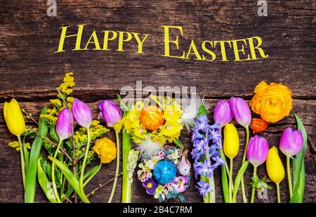 Happy Easter, colorful flowers and easter eggs Stock Photo