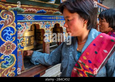 Spinning prayer wheel at Kyichu Lhakhang Temple near Paro in Himalayas mountains Bhutan, South Asia, Asia. Inner courtyard with an incense burner and Stock Photo