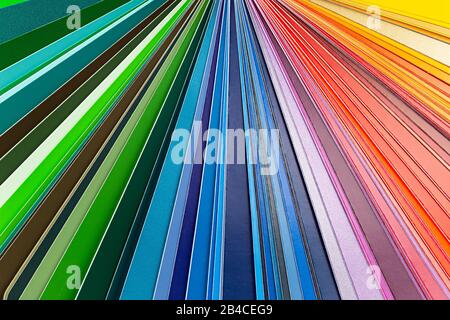 Color fan chart catalog spectrum of all kind of various colors to choose paint from book. DIY renovation home improvement concept macro close-up abstr Stock Photo