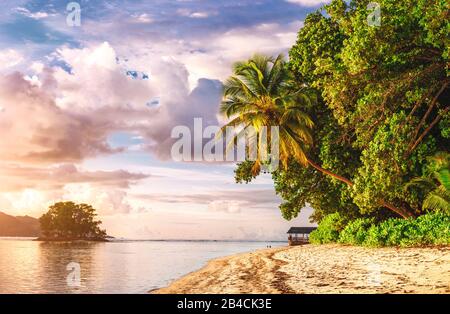 Famous paradise Anse Source d'Argent beach at La Digue in sunset light, Seychelles.