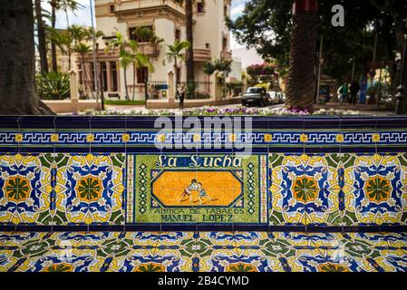 Spain, Canary Islands, Tenerife Island, Santa Cruz de Tenerife, Plaza 25 de Julio, early 20th century park with benches covered in antique advertising made of azulejo tiles Stock Photo