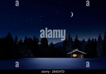 Christmas-lit hut in cold winter night with a starry sky Stock Photo
