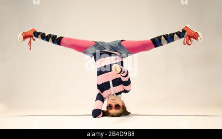 girl in a unique breakdance position,unique kid,crazy girl, cool girl Stock Photo