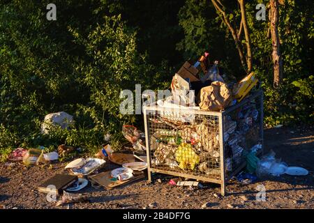 overfull garbage container, Flaucher, Thalkirchen, Munich, Upper Bavaria, Bavaria, Germany Stock Photo