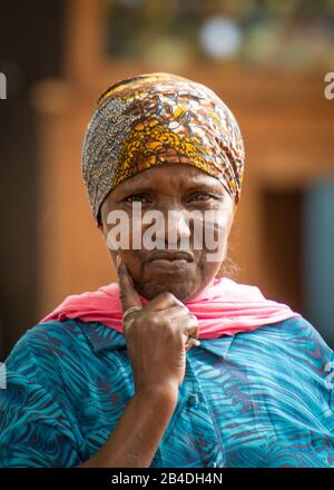 Tanzania, northern Tanzania at the end of the rainy season in May, Serengeti National Park, Ngorongoro Crater, Tarangire, Arusha and Lake Manyara, Masai woman at the village road, Portrait Stock Photo