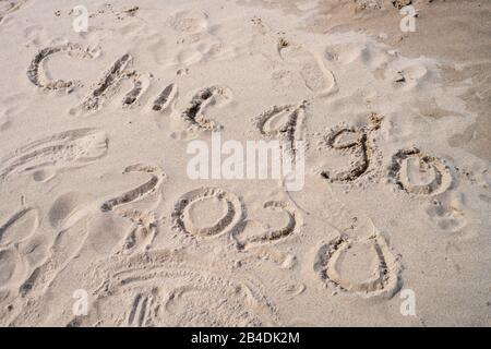 'Chicago 2020' written in sand on the beach of Lake Michigan Stock Photo