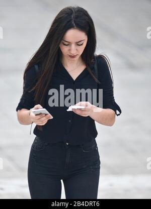 A young girl looking for a directions in Syntagma Square, Athens, Greece Stock Photo