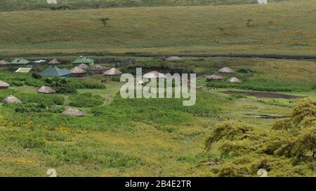 A foot, tent and jeep safari through northern Tanzania at the end of the rainy season in May. National Parks Serengeti, Ngorongoro Crater, Tarangire, Arusha and Lake Manyara. Maasai village in Ngorongoro Crater. Stock Photo