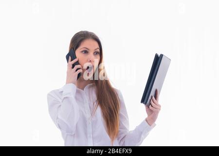 Successful businesswoman looks amazed at a tablet Stock Photo