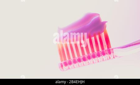 Pink plastic toothbrush with a thick layer of white toothpaste on an isolated background. Stock Photo