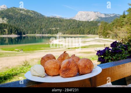 Crnogorske priganice, fried yeast dough balls, breakfast, Crno jezero, Durmitor National Park, Zabljak province, Montenegro Stock Photo