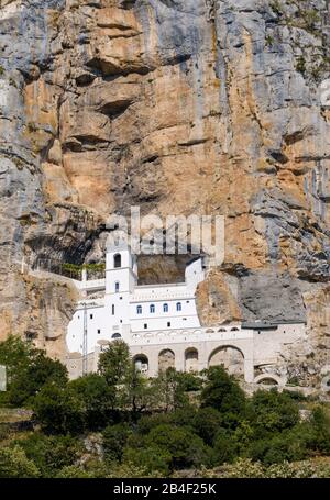 Serbian Orthodox Monastery Ostrog, church in rock face, Danilovgrad province, Montenegro Stock Photo