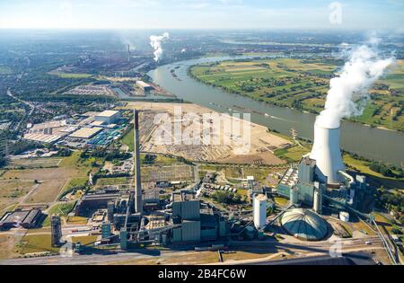 Aerial view of logistics location logport VI in Duisburg-Walsum on the Rhine on the fallow land of a former paper mill near hard coal power plant, coal power plant STEAG and beverage logistics RheinfelsQuellen H. Hövelmann GmbH & Co. KG in Duisburg in the Ruhr area in the federal state of North Rhine-Westphalia in Germany. Stock Photo