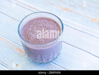 Strawberry blueberry kale smoothie in a glass. Stock Photo