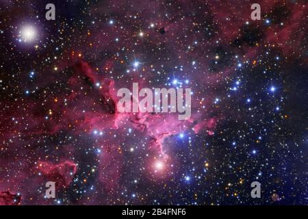 A beautiful nebula of different colors, with stars and galaxies. Elements of this image were furnished by NASA. Stock Photo