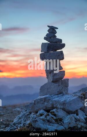 characteristic pile of stones (little stones man) as a signpost on Dürrenstein, Braies Dolomites, South Tyrol, Bolzano, Italy Stock Photo