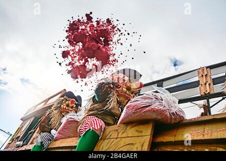 Europe, Switzerland, Basel, Traditional event, Basel Fasnacht, the largest in Switzerland, intangible cultural heritage of humanity, Cortège at the Wettsteinplatz, waggis on theme cars with confetti Stock Photo