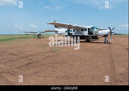 Two airplane on Olkiombo Airstrip, Masai Mara National Reserve, Kenya, Africa Stock Photo