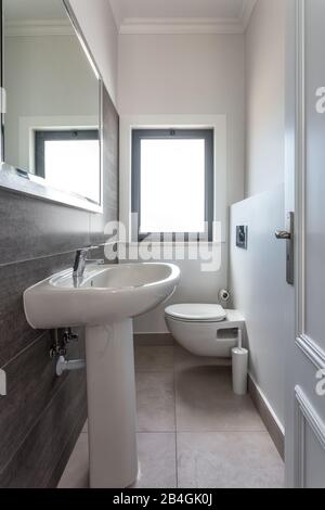 Modern bathroom shower room with toilet and amenities Stock Photo