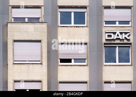 The logo of the health insurance DAK on the facade of an office and business building in Gießen. Stock Photo