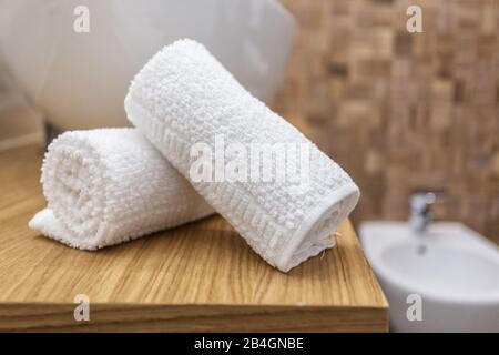 Two towels in a roll in the bathroom Stock Photo
