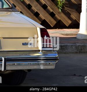 Backside of a brand new yellow Chevrolet Monte Carlo in the park Stock Photo