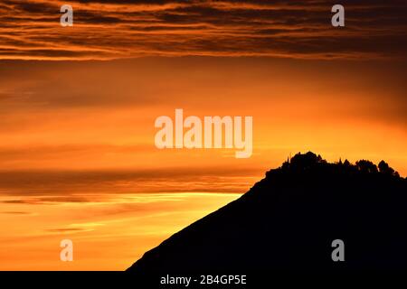 Sierra Elvira silhouette in Granada at sunset with beautiful orange tones Stock Photo