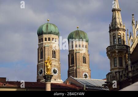 Europe, Germany, Bavaria, City of Munich, Marienplatz, New Town Hall in the Neo-Gothic style, built 1867 to 1908, bell and figure play in the town hall tower, towers of the Frauenkirche