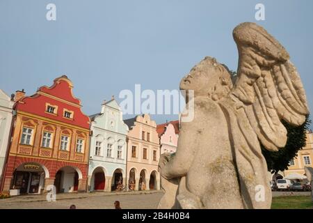 Baroque statue of angel as part of Holy Trinity column. Telc, Czech Republic Stock Photo