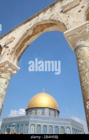 Israel, Jerusalem, Dome of the Rock. The jewel in the crown of Temple Mount / Al Haram Ash Sharif is the gold-plated Dome of the Rock, the enduring symbol of the city and one of the most photographed buildings on earth. As its name suggests, the dome covers a slab of stone sacred to both the Muslim and Jewish faiths. According to Jewish tradition, it was here that Abraham prepared to sacrifice his son. Islamic tradition has the Prophet Muhammad ascending to heaven from this spot Stock Photo