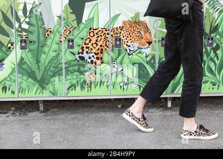 Mural, Leopard, woman in shoes with Leopard pattern Stock Photo