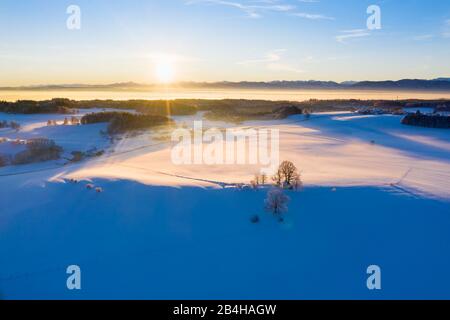 Maria-Dank-Kapelle on Fürst-Tegernberg in winter at sunrise, Degerndorf bei Münsing, drone shot, Alpine foothills, Upper Bavaria, Bavaria, Germany Stock Photo