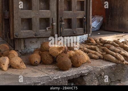 Destination Tanzania, Zanzibar Island: Impressions from Stone Town, the oldest part of Zanzibar City, the capital of the Tanzanian state of Zanzibar at the end of Ramadan. Coconut sale on the roadside. Stock Photo