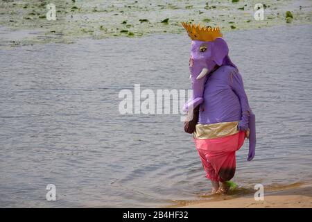 Kiev, Ukraine - July 28, 2018: Man in a suit Hindu god Ganesh is on the bank of the river. Festival of Vedic culture Vedalife Stock Photo