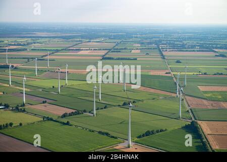 Aerial view of a landscape of agricultural fields and wind turbines Stock Photo