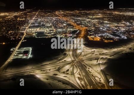 Flying over the suburbs of Toronto at night on a flight to Newfoundland, Canada Stock Photo