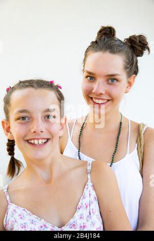 Half portrait, sisters, smiling Stock Photo