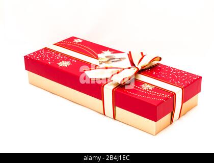Red chocolate box with tag label and red yellow bow ribbon isolated on white Stock Photo