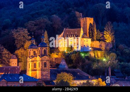 Miltenberg on the Main, Bavaria, Lower Franconia, Mildenburg and parish church of St. james with excursion boats on the Main at dusk Stock Photo